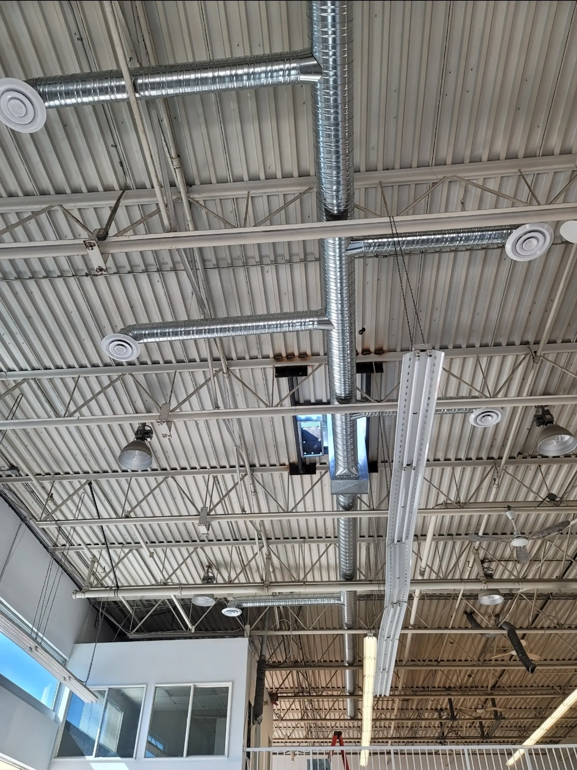 Flex ductwork with round diffusers metal roof